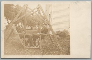 TWO MEN IN SWING ANTIQUE REAL PHOTO POSTCARD RPPC