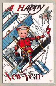 New Year Greetings Boy Flying Airplane Artist Signed Vintage Postcard AA74531