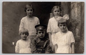 RPPC Edwardian Children Girls Big White Bow Boy In Uniform c1917 Postcard Q22