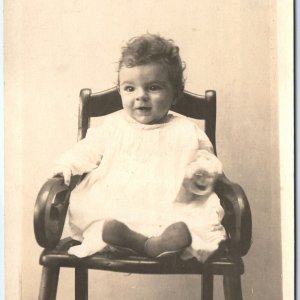 c1910s Adorable Goofy Looking Baby Boy or Girl RPPC Child Smiles Real Photo A159