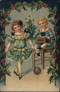1913 Christmas Children Playing Opening Gifts Fancy Clothing EMBOSSED