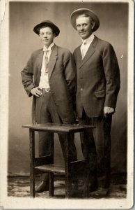 RPPC Two Men Oddly Posed Suits c1910 Real Photo Postcard V5