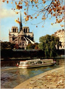postcard Paris France Notre-Dame, and the Seine with tourboat