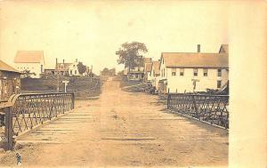 Wellington ME Dirt Street View Store Fronts Iron Bridge RPPC Postcard