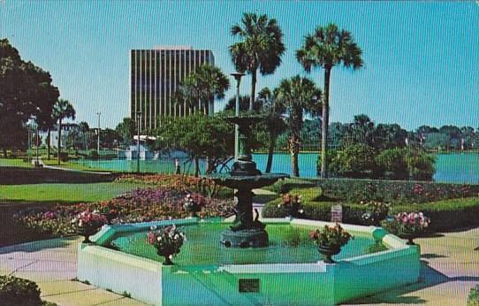 Florida Orlando The Action Center Flowers Trees And Fountain At Lake Eola 1973