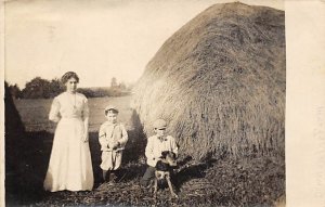 Woman with her two children and dogged by haystack R.P.O., Rail Post Offices ...