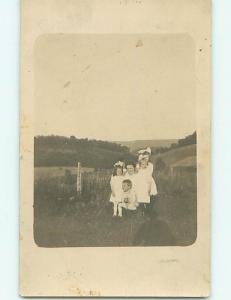 Pre-1918 rppc THREE GIRLS WITH BOWS IN HAIR WITH MOM & BROTHER r5956