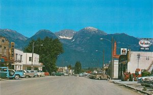 Postcard Montana Ronan 1960s Street Mission Mountains autos Lauretta 23-7940