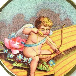 1889 Lovely Round Cupid Shooting His Arrow Flowers Valentine Victorian Card F92