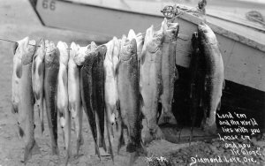 RPPC DIAMOND LAKE OREGON BOAT & FISH CATCH REAL PHOTO POSTCARD (c. 1930s)