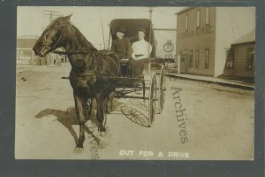 Larimore NORTH DAKOTA RPPC c1910 MAIN STREET Buggy Johnson House nr Grand Forks