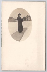 RPPC Woman Long Coat Hand Muff On Sidewalk Oval Masked Photo Postcard P25