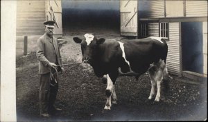 Quality Photography Farmer in Cap w/ Cattle Cow Nose Ring c1905 RPPC Postcard