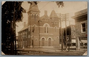 Postcard RPPC c1920s Brockport NY Methodist Church Street View Main St & Erie St