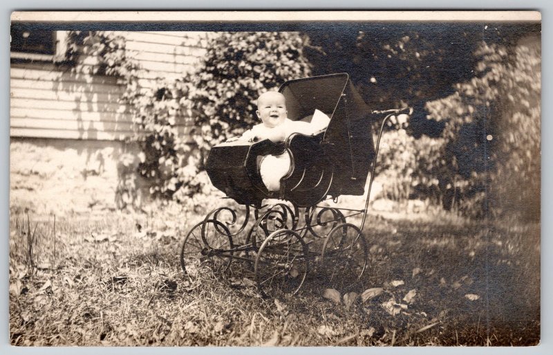 Real Photo Postcard~Laughing Baby Outside in Ornate Victorian Buggy~c1908 RPPC 