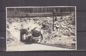 CANADA, BANFF, ALONG THE LINE OF THE CPR, TRAIN EXITING TUNNEL, c1920 photo ppc.