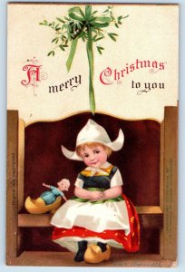 Christmas Dutch Kid With Doll Under Mistletoe Ellen Clapsaddle Signed Postcard