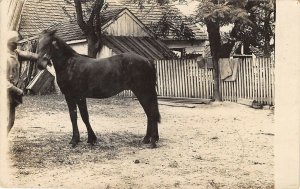 Hooper Nebraska~Man With Horse~House~Mothers Asks Excuse this Card~1911 RPPC 