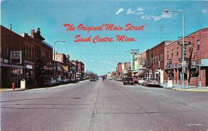 1960s SAUK CENTER MINNESOTA Main Street automobiles postcard 1694