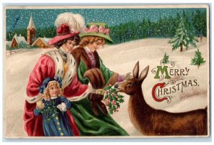 c1910's Christmas Woman And Girl Feeding Deer Berries Winter Embossed Postcard