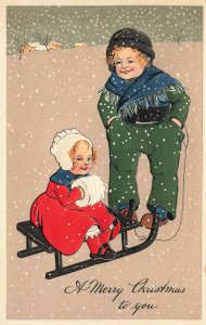 A Merry Christmas to you Boy & Girl Sled Snow Storm P.F.B. Postcard