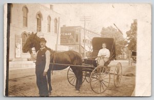 RPPC Couple Horse Buggy Street Scene Cigar Advert Reichert Hardware Postcard R30