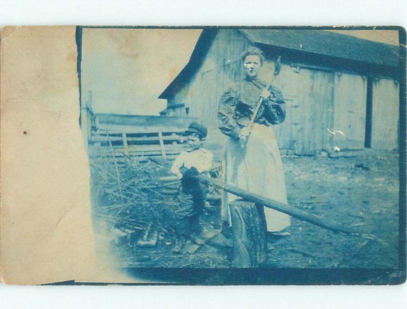 Pre-1920 rppc WOMAN CHOPS WOOD Postmarked Toledo Ohio OH i7191