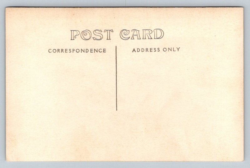 RPPC  Couple Outside Restaurant in Rocking Chairs   Postcard