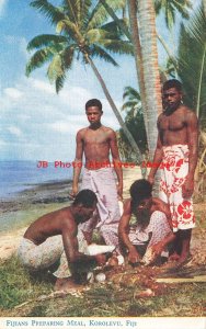 Fiji, Korolevu, Fijians in Native Costume Preparing a Meal