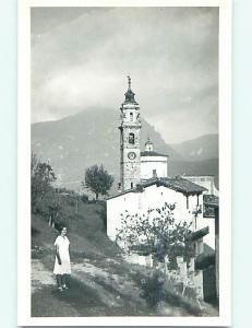 Old rppc GIRL STANDS BY OLD BUILDING WITH BELL TOWER r6576