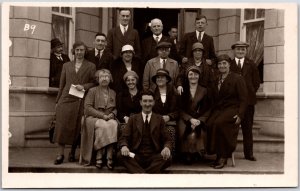 Group Picture Ladies And Gentlemen Front of Building Real Photo RPPC Postcard