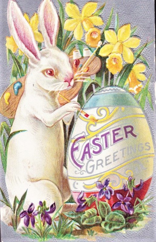 Easter Bunny painting a big Easter Egg says EASTER GREETINGS EMBOSSED. UNUSED