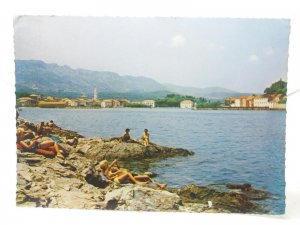 Holidaymakers Sunbathing on Rocks at Jelsa Croatia Vintage Postcard