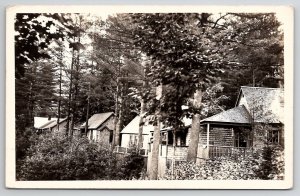 RPPC Row of Wooden Cabins Camp Site Nestled Among Trees c1930s Postcard M38