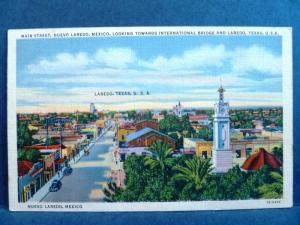 Postcard Mexico Main Street Nuevo Laredo Looking toward Laredo Texas