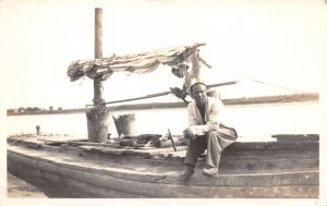 Peking China Fisherman Man on Boat Real Photo Vintage Postcard AA71285