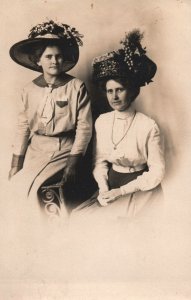 VINTAGE POSTCARD ARTURA REAL PHOTO CARD (RPPC) TWO WOMEN WITH EXTRAVAGANT HATS