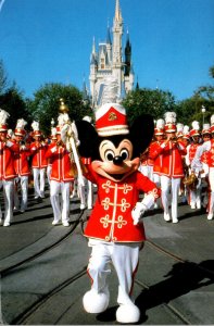 Walt Disney World Cinderella Castle and Mickey Mouse Leading The Walt Disney ...