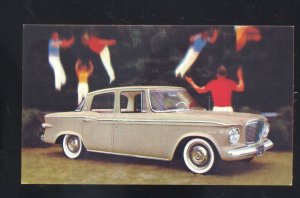 1960 STUDEBAKER LARK 4 DOOR SEDAN AUGUSTA MAINE CAR ADVERTISING POSTCARD