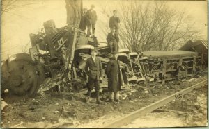 RPPC Men Standing on Train Wreck Lying on Side Derailed Real Photo Postcard