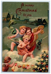 c1910's Christmas Tree Decorating Angels Cherub Winter Embossed Antique Postcard 