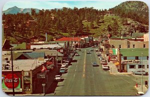 VINTAGE POSTCARD STREET SCENE STORE SIGNAGE COKE ADVERTISING ESTES PARK COLORADO