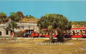 Colorful Steam Engine and train passing the old Fort at Fort De Soto Park Flo...