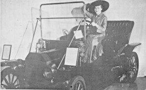 WOMAN HOLDS ON TO HAT-POSING IN FORD MODEL T-PIONEER VILLAGE NEBRASKA POSTCARD