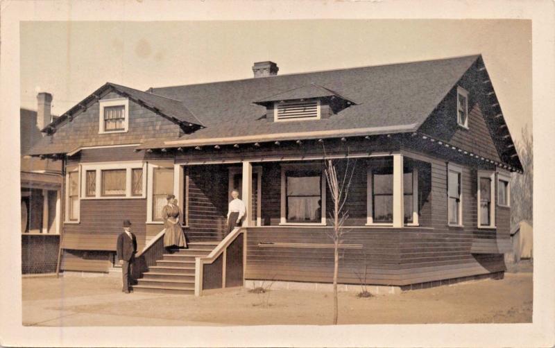 MAN & 2 WOMEN ON FRONT PORCH OF RANCH STYLE HOUSE-REAL PHOTO POSTCARD 1910s