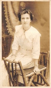 c1910 RPPC Real Photo Postcard Young Woman Seated on Rustic Log Bench