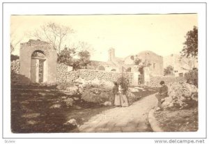 RP: Old woman carrying wood on back, Italy, 00-10s Church next don Villa Nuy...