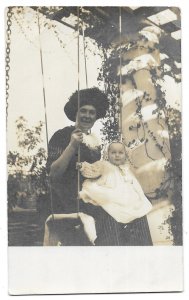 Mother on Swing Holding Baby, Unmailed AZO Real Photo Post Card RPPC c1910