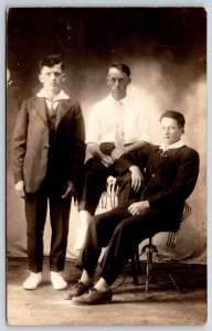 Three Young Men Suits & Ties Portrait Serious Look Postcard Real Photo