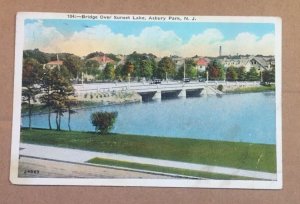 1928 USED .01 POSTCARD - BRIDGE OVER SUNSET LAKE, ASBURY PARK, NEW JERSEY